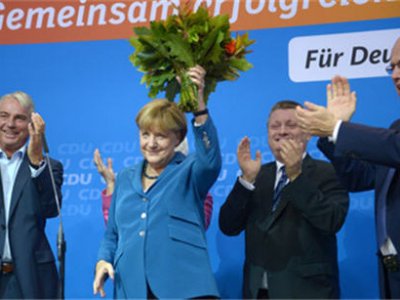 Ангела Меркель празднует победу